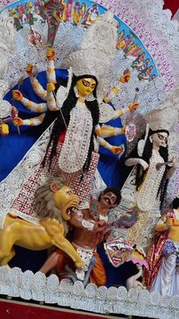 Maa Durga Idol in Blue and White with Many Arms and Lion at Durga Puja Pandal