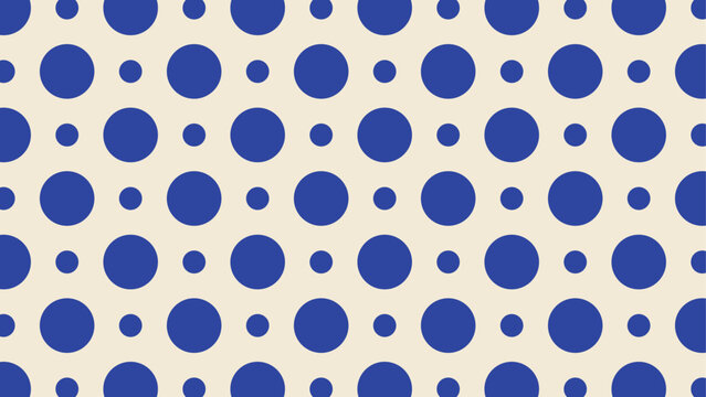 Seamless blue polka dot pattern on cream background for textile and