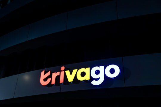 Dusseldorf, North Rhine-Westphalia, Germany, September 27, 2026: Headquarter of trivago in D&uuml;sseldorf Medienhafen by night shows Logo of the travel management company for international travel and holi