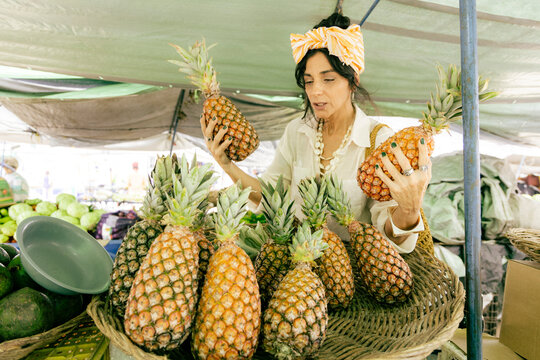 Mature Woman 50+ Exploring Local Food Market, Shopping Fresh Tropical Fruits During Authentic Travel Experience