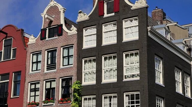 Traditional Dutch Canal Houses with Ornate Gabled Facades in Amsterdam, Netherlands