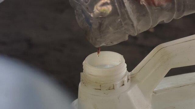 Close-up footage of alcoholic spirit distillation drips. Alcohol distillation process.