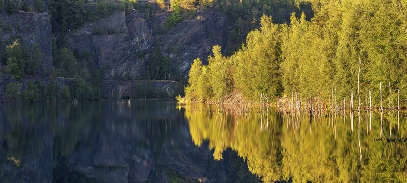 The slate lake in the Kie&szlig;lichbruch in the evening light, former slate quarry, birch forest on the shore, Technical monument of the historic slate mining Lehesten, Thuringia, Germany