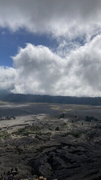 Natural morning view from top of Mount Bromo crater looking over Tengger caldera and sea of clouds, East Java, Indonesia unedited no filter