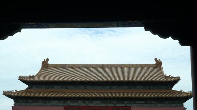 Imperial Palace Architecture Framed by a Traditional Gate in the Forbidden City, Beijing, China