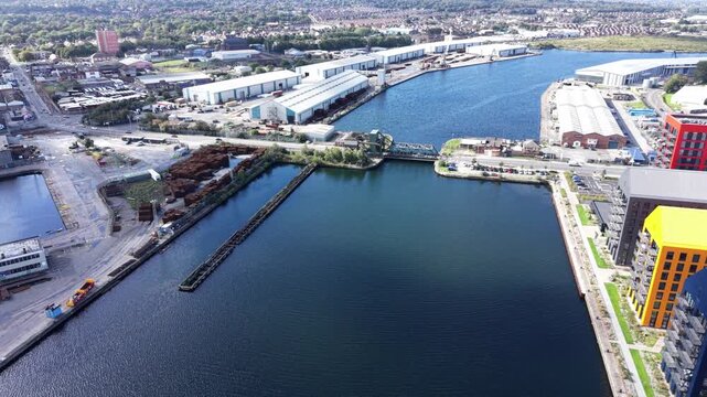 Aerial drone 4K view of Wallasey Dock water and housing rows glowing in warm afternoon sky Wallasey Dock UK