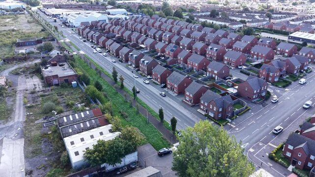Aerial drone 4K footage showing Birkenhead Park bridges glowing under warm sunlight with surrounding housing illuminated by vivid natural tones Birkenhead Park UK
