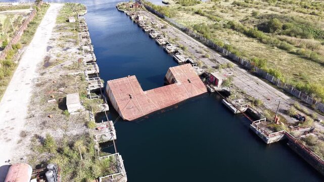 Aerial drone 4K view of Wallasey Dock water and housing rows glowing in warm daylight Wallasey Dock UK