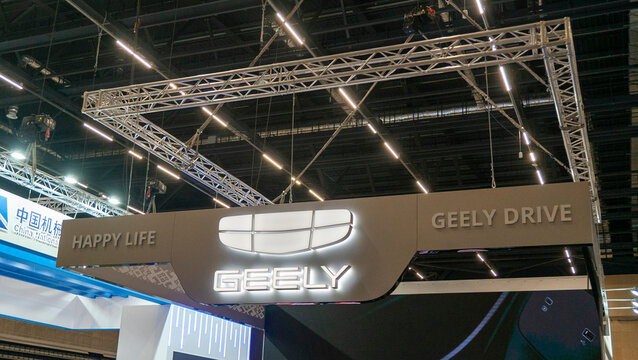 Geely had a prominent display at an automotive exhibition, featuring a variety of branding and promotional content to engage attendees