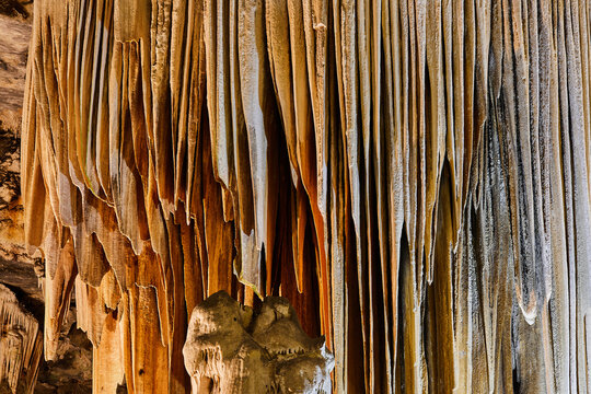 Curtains of dripstone formations inside the Cango Caves