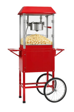Vibrant red popcorn machine cart with glass panels and a full batch of freshly popped corn, isolated on a clean white background