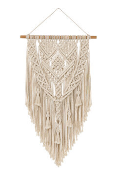 Beautiful handmade macrame wall hanging with intricate woven patterns and tassels, suspended from a wooden dowel on a clean white background
