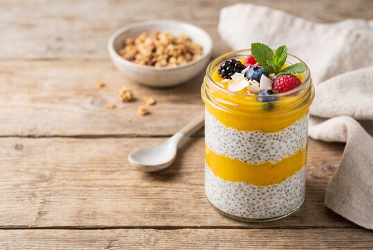 Colorful chia pudding layered with mango puree
