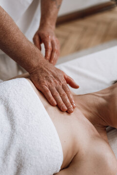 Woman receiving professional shoulder massage for wellness and relaxation