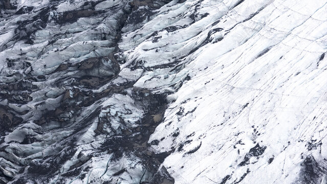 Aerial view of the intricate ice patterns and deep crevasses of the glaciers in Kirkjubaejarklaustur, Skaftarhreppur, Iceland.