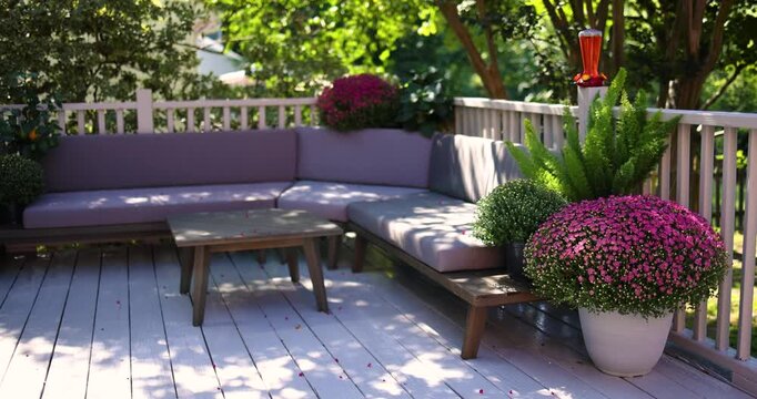Beautiful Garden Terrace with Pink Chrysanthemums and Comfortable Outdoor Seating