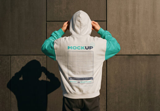 Person Wearing Hoodie from Back Fashion Branding Design Mockup