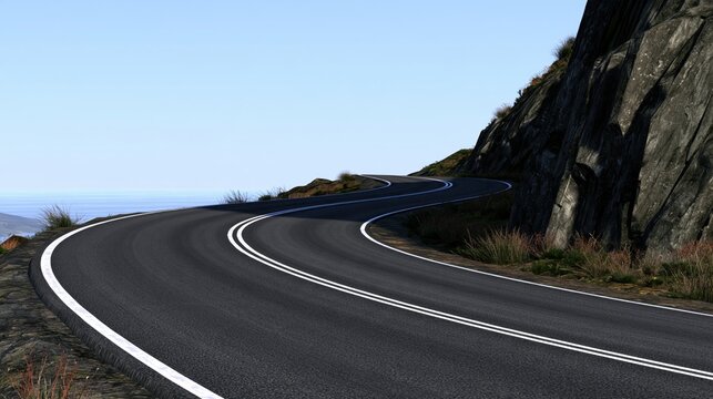 Winding mountain road with sharp curves and double white lines along rocky cliff under clear blue sky
