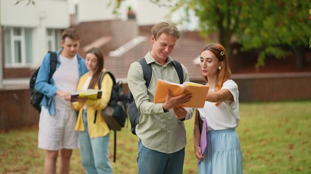 Young university students studying together on campus