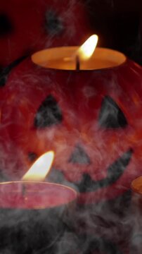 Halloween jack o lantern pumpkin in a full fog ambient