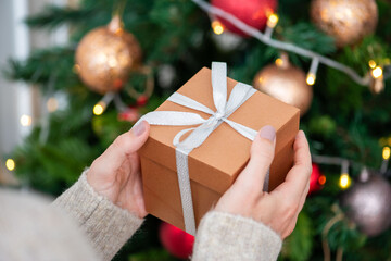 Fototapeta premium Gift box near Christmas tree.