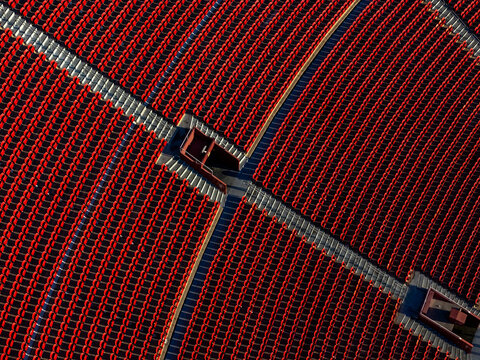 Aerial view of the red seating sections at the LA Memorial Coliseum in Los Angeles, California, United States.