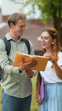 University students discussing homework together on campus