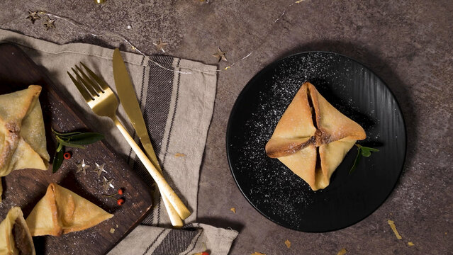 Traditional Pitos de Santa Luzia from Vila Real on a Black Plate