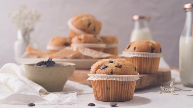 Chocolate Chip Muffins with Milk in Glass Bottles