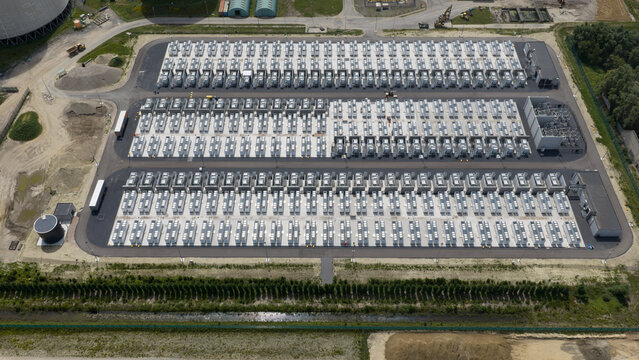 Aerial view of a large-scale battery energy storage system facility with rows of battery containers and electrical infrastructure in Vilvoorde, Vlaanderen, Belgium.