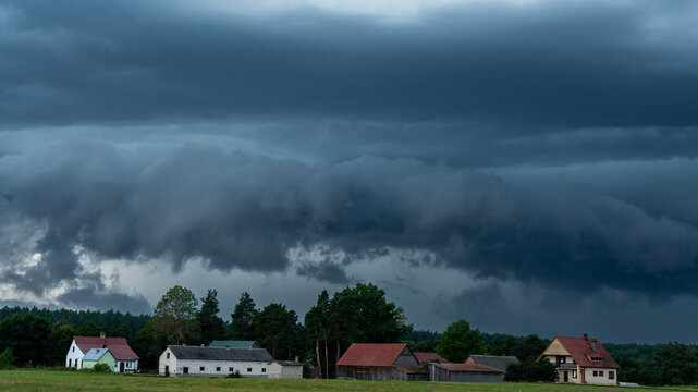 Dramatic and dangerous shelf cloud of an approaching severe thunderstorm during a hot summer day.