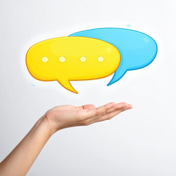 Speech bubble graphic floating above open hand, representing online chat, digital communication, social media, messaging, and creative conversation concept on white background