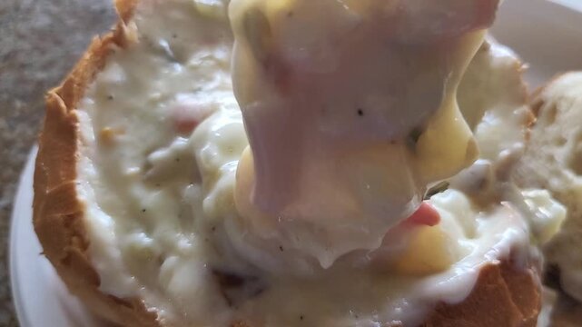 Creamy Seafood Chowder Served Inside Sourdough Bread
