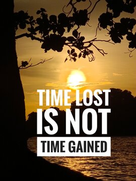 A scenic sunset over a calm lake framed by silhouetted tree branches with a motivational text about time management. Time lost is not time gained inspirational and motivational quotes.