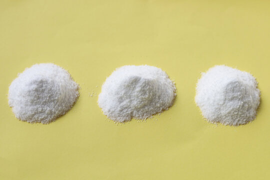 White creatine powder, used as a pre-workout supplement for gym and fitness.