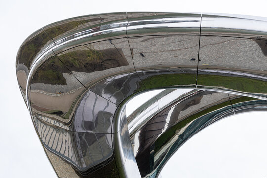 View of the reflective, curved metallic facade of the FENIX museum building, Rotterdam, Zuid-Holland, Netherlands.