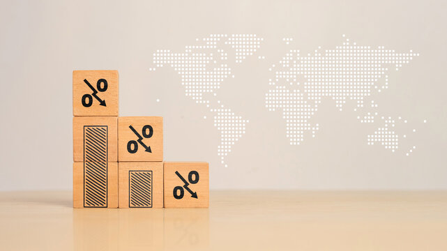 Wooden blocks with percentage sign and down arrow, financial recession crisis, interest rate decline, investment reduce, risk management concept