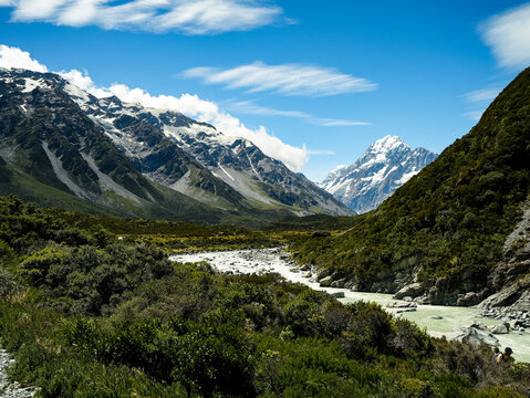 View of the Hooker Valley track with snow-capped Aoraki Mount Cook, featuring a glacial river flowing through the valley in Mt Cook National Park, Canterbury Region, New Zealand.