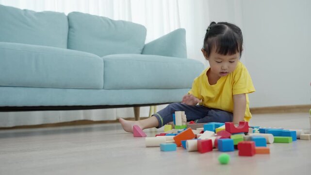 Happy Asia children play and learn toy blocks.family is happy and excited in the house. daughter having fun spending time, Activity, development, IQ, EQ, meditation, brain, muscles, essential skills.