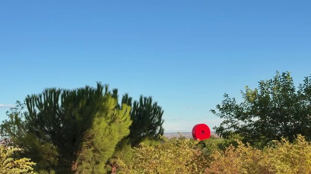 Beautiful view of a park in Madrid, Spain, under a clear blue sky during a sunny day in early fall