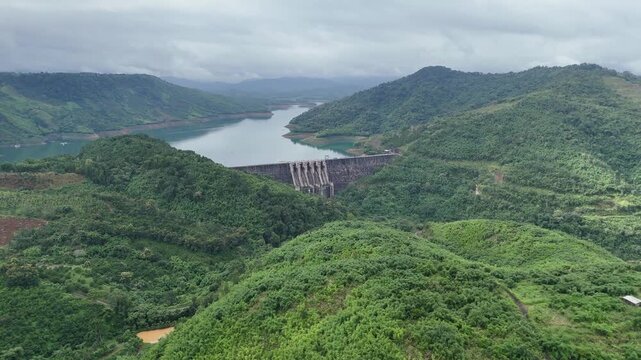 Aerial view of Ta Dung Lake with green hills and Dam. Dak Nong, central Vietnam.
