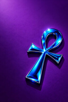 A glossy, metallic blue ankh symbol, representing life, illuminated with bright light against a deep, solid purple background, with soft shadows