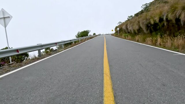 Scenic Mountain Road through High Altitude Landscape. Driving POV.