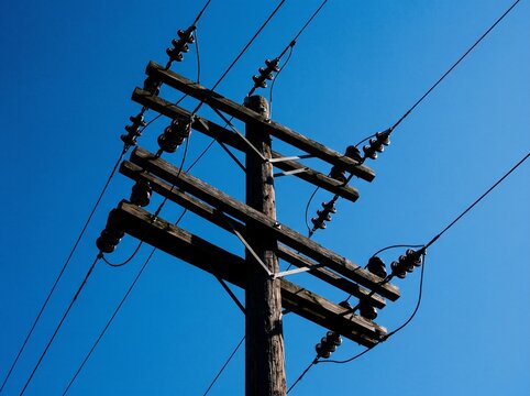 high voltage power lines with sky background