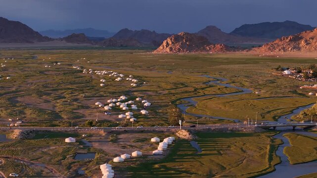 Aerial view of Mongolian Yurts and River, Sunset light Near Khovd City