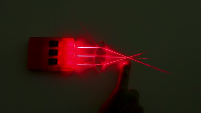 Red Laser Beam Refraction Physics Experiment with Convex Lens