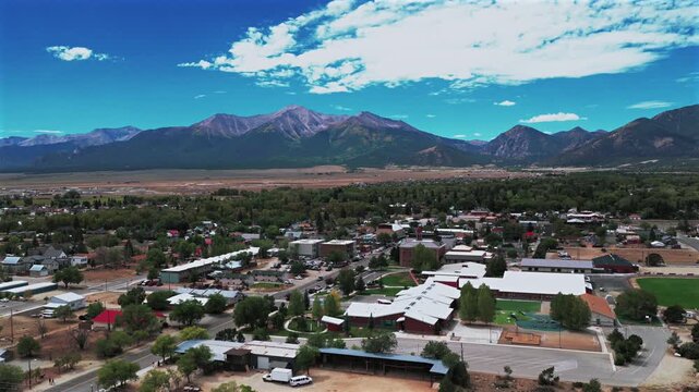 Collegiate Peaks Downtown Buena Vista view Rocky Mountains small town Main Street Summer Fall morning blue sky drone aerial Colorado Mount Princeton Mt Yale fourteener peaks Cottonwood Pass upwards