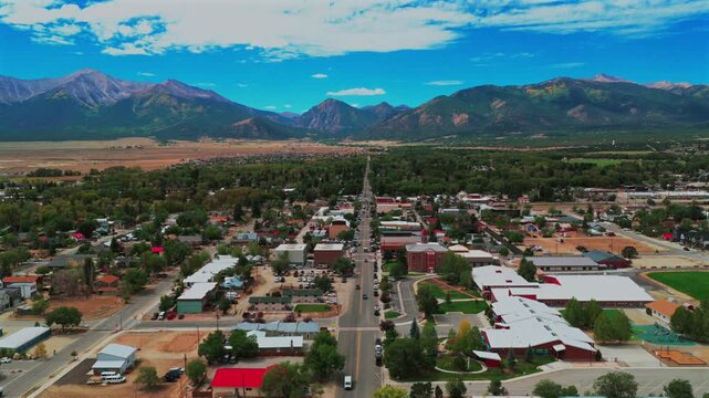 Downtown Buena Vista Rocky Mountains small town cars Summer Fall morning blue sky drone aerial Colorado Collegiate Peaks Mount Princeton Yale fourteener peaks Cottonwood Pass Main Street forward pan