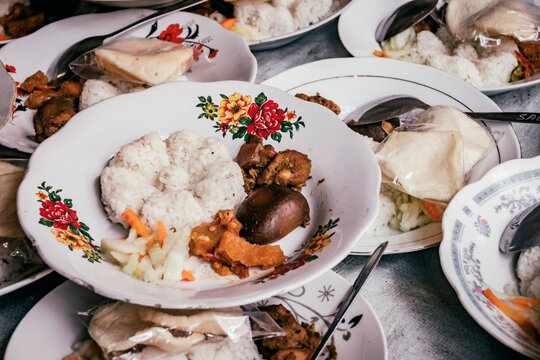 Nasi campur, or nasi rames, is a signature Javanese dish consisting of white rice served with a variety of side dishes.