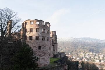 Historic castle ruins overlooking a wooded valley © iBennn